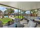Inviting covered patio with comfortable seating, perfect for outdoor relaxation and entertaining overlooking the pool at 6521 69Th N Ave, Pinellas Park, FL 33781