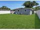 Expansive backyard with a well-maintained lawn, offering ample space for outdoor enjoyment and recreation at 6527 S West Shore Cir, Tampa, FL 33616