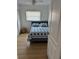 Bedroom featuring a cozy blue and white bed with a closet at 6527 S West Shore Cir, Tampa, FL 33616