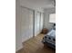 Bedroom features a closet for storage, and a ceiling fan at 6527 S West Shore Cir, Tampa, FL 33616