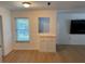 Bright dining area featuring wood floors, a built-in storage cabinet, and natural light through the window at 6527 S West Shore Cir, Tampa, FL 33616