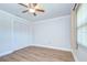 Bedroom featuring a bi-fold closet, light-colored walls, and light-colored wood flooring at 6550 Teak Ct, Zephyrhills, FL 33542