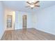 Bedroom features a closet and access to a bathroom and walk-in closet at 6550 Teak Ct, Zephyrhills, FL 33542