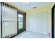 The bright sunroom features tiled floors and a door leading to the backyard at 6550 Teak Ct, Zephyrhills, FL 33542