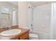 Bathroom featuring shower-tub combo and laminate counters on wood vanity at 6920 Towering Spruce Dr, Riverview, FL 33578