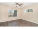 Neutral bedroom offers natural light and hard surface floors at 6920 Towering Spruce Dr, Riverview, FL 33578