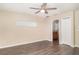 Hard surface floors and neutral paint in spacious bedroom at 6920 Towering Spruce Dr, Riverview, FL 33578