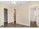 Bedroom view featuring closet and bathroom entrances with hard surface flooring at 6920 Towering Spruce Dr, Riverview, FL 33578