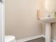 Bright half-bathroom showcases a pedestal sink and gray tone flooring at 6920 Towering Spruce Dr, Riverview, FL 33578