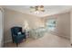 Cozy bedroom featuring a comfortable bed, side tables with lamps, and a relaxing blue armchair with matching pillow at 709 Grand Canyon Dr, Valrico, FL 33594