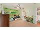 Well decorated bedroom featuring a wooden bed and an entrance to the bathroom at 709 Grand Canyon Dr, Valrico, FL 33594