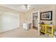Neutral bedroom featuring a closet, desk and a yellow decorative cabinet at 709 Grand Canyon Dr, Valrico, FL 33594