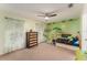Well decorated bedroom featuring a wooden bed, windows, and a ceiling fan at 709 Grand Canyon Dr, Valrico, FL 33594