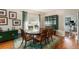 Charming dining room with hardwood floors, an area rug, and a wooden table with seating for six at 709 Grand Canyon Dr, Valrico, FL 33594
