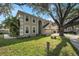 Attractive home featuring a well-manicured lawn, neutral siding, and an attached three car garage at 709 Grand Canyon Dr, Valrico, FL 33594
