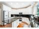 Spacious kitchen featuring white cabinets and modern stainless steel appliances at 709 Grand Canyon Dr, Valrico, FL 33594