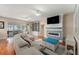 Comfortable living room featuring a sliding glass door and built-in storage at 709 Grand Canyon Dr, Valrico, FL 33594