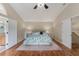 Spacious main bedroom with hardwood floors, vaulted ceiling, a king-size bed, and ensuite bathroom access at 709 Grand Canyon Dr, Valrico, FL 33594
