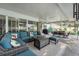 Wide angle view of covered patio including both seating and dining areas, along with a pool at 709 Grand Canyon Dr, Valrico, FL 33594