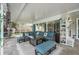 Comfortable covered patio area boasts stylish seating, a textured rug, and plenty of space for relaxation at 709 Grand Canyon Dr, Valrico, FL 33594