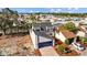 Charming home with a blue garage door, surrounded by lush landscaping at 7318 Bellows Falls Ln, Hudson, FL 34667