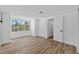 Bright bedroom featuring a large window and white trim at 7318 Bellows Falls Ln, Hudson, FL 34667
