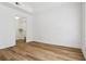 Bright bedroom featuring vinyl plank flooring and a walk-in closet with shelving at 800 S Dakota Ave # 204, Tampa, FL 33606