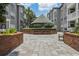 Relaxing courtyard featuring comfortable benches and a shaded gazebo, surrounded by lush landscaping at 800 S Dakota Ave # 204, Tampa, FL 33606