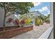 Scenic courtyard with lush landscaping, paved walkways, and serene sitting areas at 800 S Dakota Ave # 204, Tampa, FL 33606