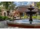Beautiful fountain with lush landscaping surrounded by shopping and restaurants in a town center at 800 S Dakota Ave # 204, Tampa, FL 33606