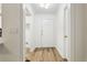 Bright foyer features wood floors, a white front door and a hall closet at 800 S Dakota Ave # 204, Tampa, FL 33606
