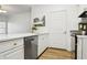 Kitchen features stainless steel appliances, a dishwasher, and white cabinets at 800 S Dakota Ave # 204, Tampa, FL 33606