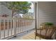 Cozy outdoor patio area featuring comfortable wicker chairs, greenery, and partial privacy wall at 800 S Dakota Ave # 204, Tampa, FL 33606