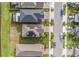 Aerial view outlining the property with solar panels on the roof at 8719 Winning Fields Rd, New Port Richey, FL 34655