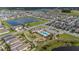 Neighborhood view with a community pool, lush landscaping, playgrounds, and recreational areas at 8719 Winning Fields Rd, New Port Richey, FL 34655