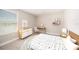 Charming bedroom with neutral walls, carpet, stylish decor, a desk, and a bright window at 8719 Winning Fields Rd, New Port Richey, FL 34655