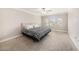 Spacious bedroom featuring a neutral color scheme, ceiling fan, and ample natural light at 8719 Winning Fields Rd, New Port Richey, FL 34655
