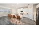 Contemporary kitchen with quartz countertops, a large island, and seating for four at the breakfast bar at 8719 Winning Fields Rd, New Port Richey, FL 34655