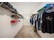 Walk-in closet with ample shelving and hanging space for organized storage at 8719 Winning Fields Rd, New Port Richey, FL 34655