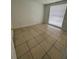 Bedroom featuring a tiled floor and a window with natural light at 9106 Telford Ct, Tampa, FL 33615