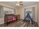 Charming Bedroom with a crib, teepee, and ample natural light from two windows at 920 York Dr, Brandon, FL 33510