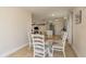 Cozy dining area with a round table and white chairs, adjacent to the kitchen and living room at 920 York Dr, Brandon, FL 33510