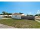 Exterior view of a single-story home featuring a fenced yard and well-maintained lawn at 920 York Dr, Brandon, FL 33510