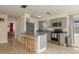Bright kitchen featuring stainless steel appliances, gray cabinets, and a breakfast bar at 920 York Dr, Brandon, FL 33510