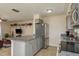 Open concept kitchen with stainless steel appliances and a breakfast bar, connecting to the living area at 920 York Dr, Brandon, FL 33510