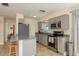 Updated kitchen featuring stainless steel appliances, gray cabinets, and stylish granite countertops at 920 York Dr, Brandon, FL 33510