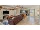 Cozy living room with tile floors, a comfortable sofa, and open access to the modern kitchen at 920 York Dr, Brandon, FL 33510