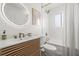 Clean bathroom featuring a sleek vanity, modern fixtures, and a shower/tub combo at 9485 Treasure Ne Ln, St Petersburg, FL 33702