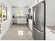 Spacious kitchen with stainless steel appliances, modern cabinetry, and ample countertop space at 9485 Treasure Ne Ln, St Petersburg, FL 33702