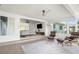 Open concept living area with modern furnishings, neutral tones, and plenty of natural light at 9485 Treasure Ne Ln, St Petersburg, FL 33702